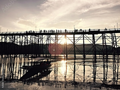 Mon bridge (wooden bridge) and boat at Sangklaburi , Kanjanaburi photo