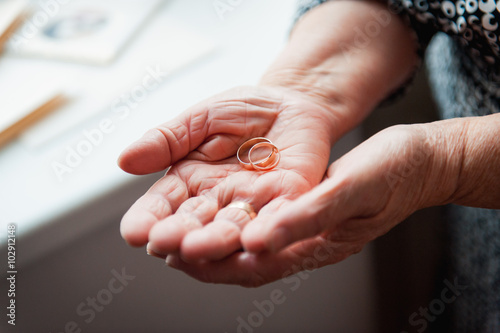 Hand 86th-years old Ukrainian women holding ring photo
