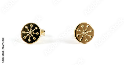 Isolated golden cufflinks