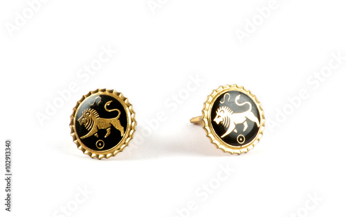 Isolated golden cufflinks with lions