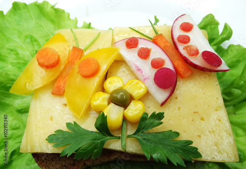 creative vegetable sandwich with cheese and sausage