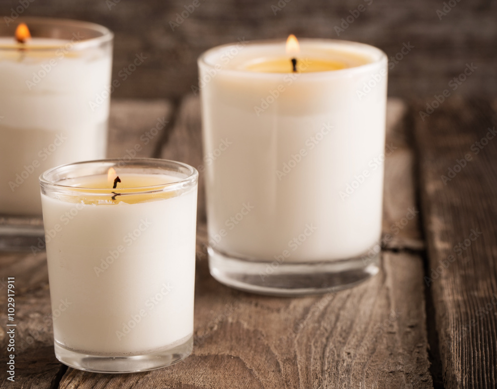 scented candles on old wooden background - obrazy, fototapety, plakaty 