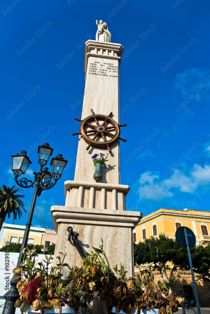 Fototapeta premium Monument at Carloforte harbor, San Pietro island, Sardinia, Italy