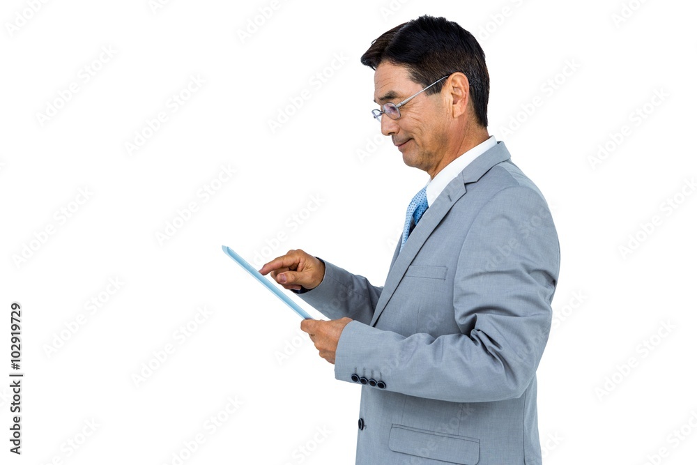 Businessman using his tablet Businessman using his tablet