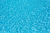 Ripple water surface and sun reflection in swimming pool