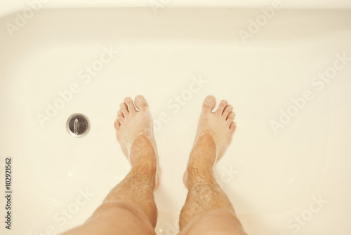 Photo of man's feet in the shower