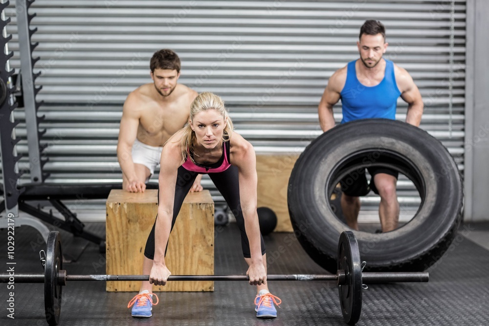 Fototapeta premium Fit people doing exercises