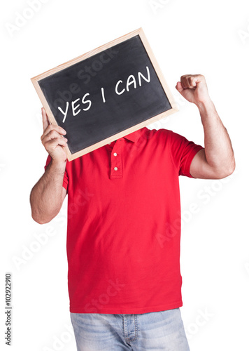 Man holding Yes I Can message written on a blackboard photo