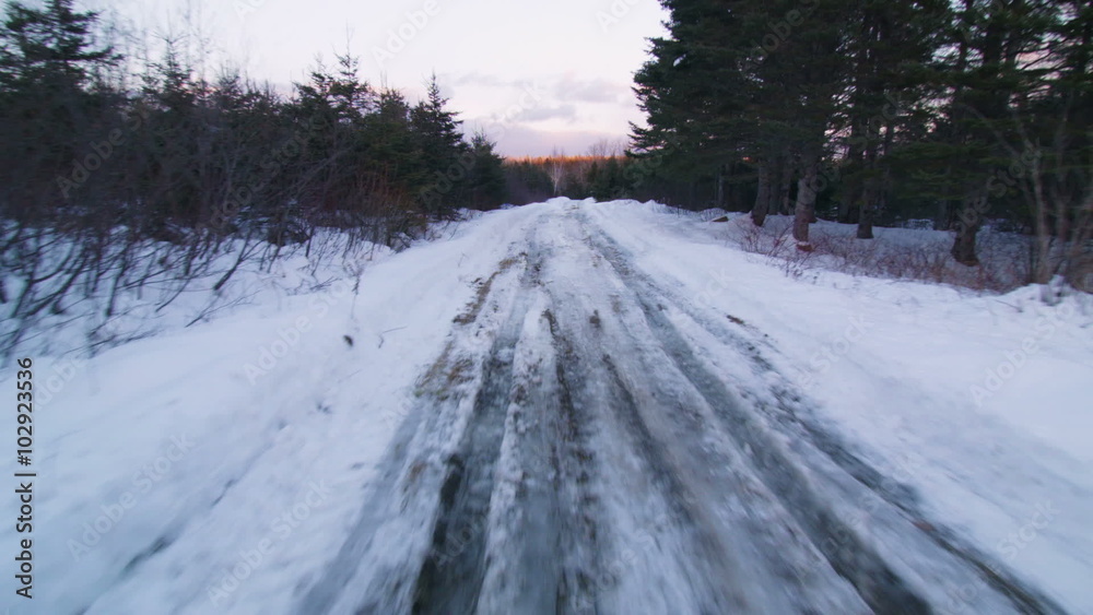 Suction Cut View from a Car Driving on a Small Off Road Path during a Winter Sunset Suction Cut View from a Car Driving on a Small Off Road Path during a Winter Sunset