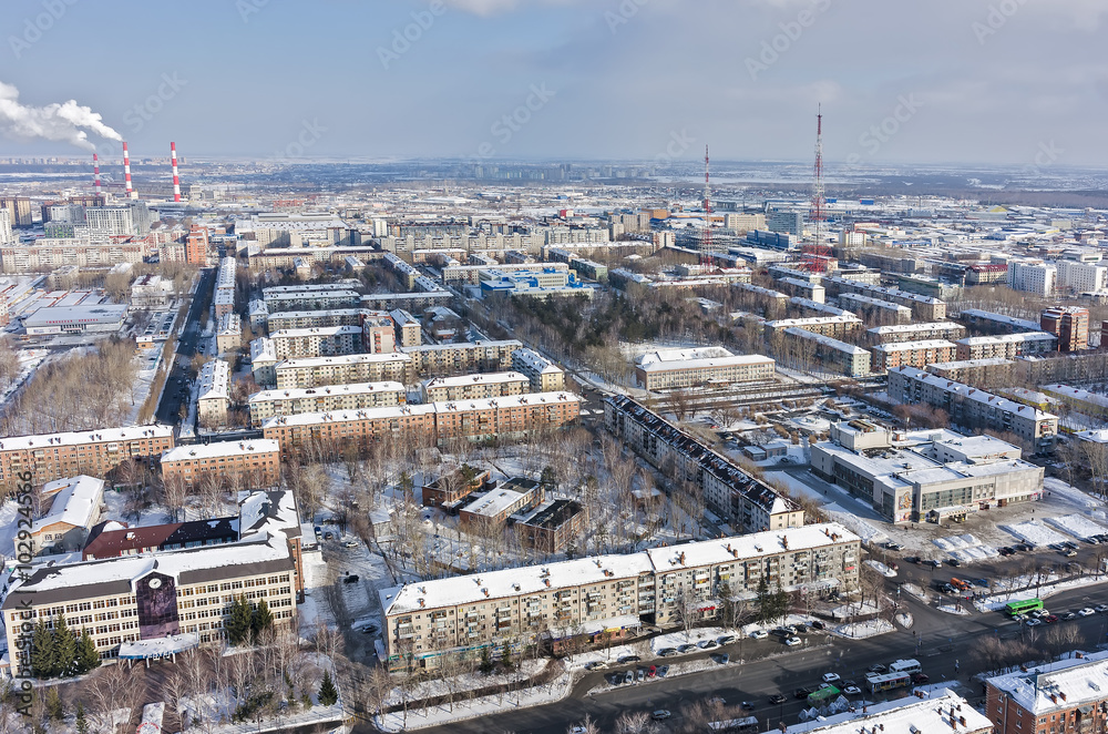 Tyumen, Russia - February 14, 2016: Aerial view onto residential area, entertaining institution of builders and TV towers on background