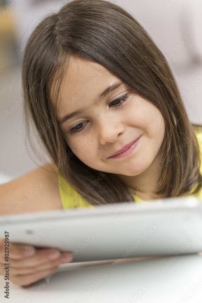 little girl with table pc at home little girl with table pc at home