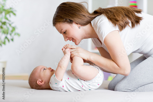 joyful mother playing and d...
