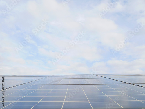 Solar cell with blue sky white clouds