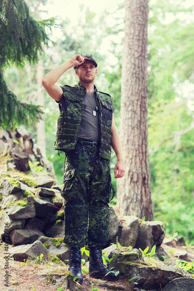 young soldier or ranger in forest