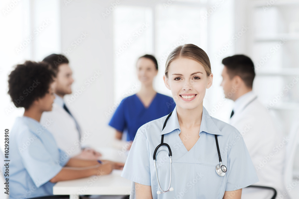 happy doctor over group of medics at hospital happy doctor over group of medics at hospital