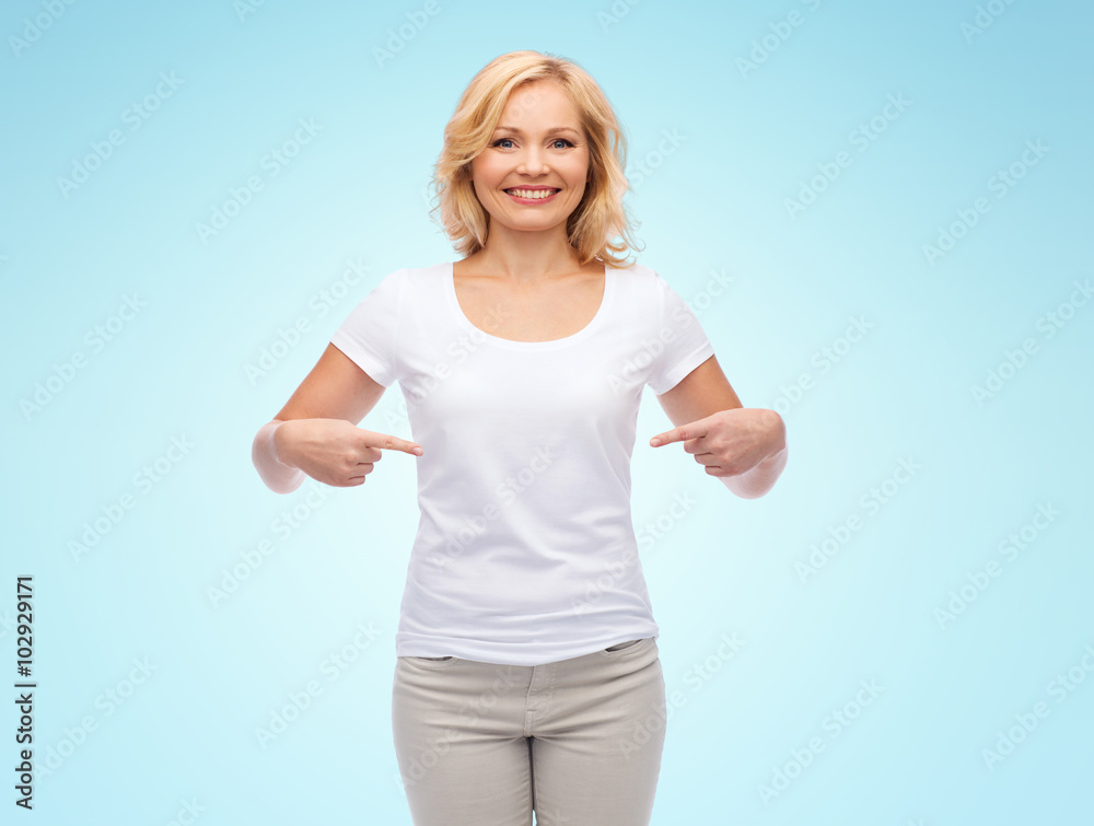 smiling woman in white t-shirt pointing to herself smiling woman in white t-shirt pointing to herself