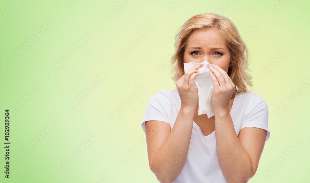 unhappy woman with paper napkin blowing nose unhappy woman with paper napkin blowing nose