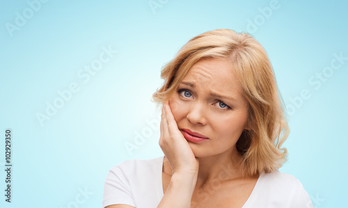 unhappy woman suffering toothache