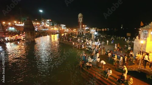 Pan shot of pilgrims at the ghats of Ganges River, Haridwar, Uttarakhand, India