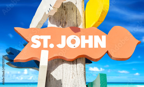 St John welcome sign with beach photo