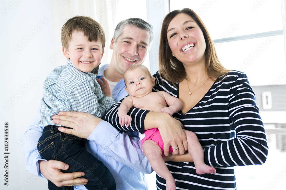 mother father their five years old son and their two months old baby mother father their five years old son and their two months old baby