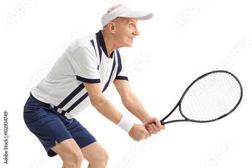 Active senior man playing tennis © Ljupco Smokovski