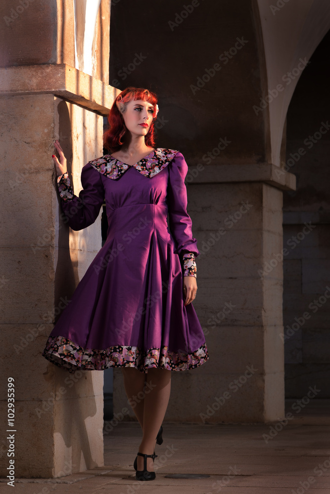 young redhead girl on a retro vintage dress