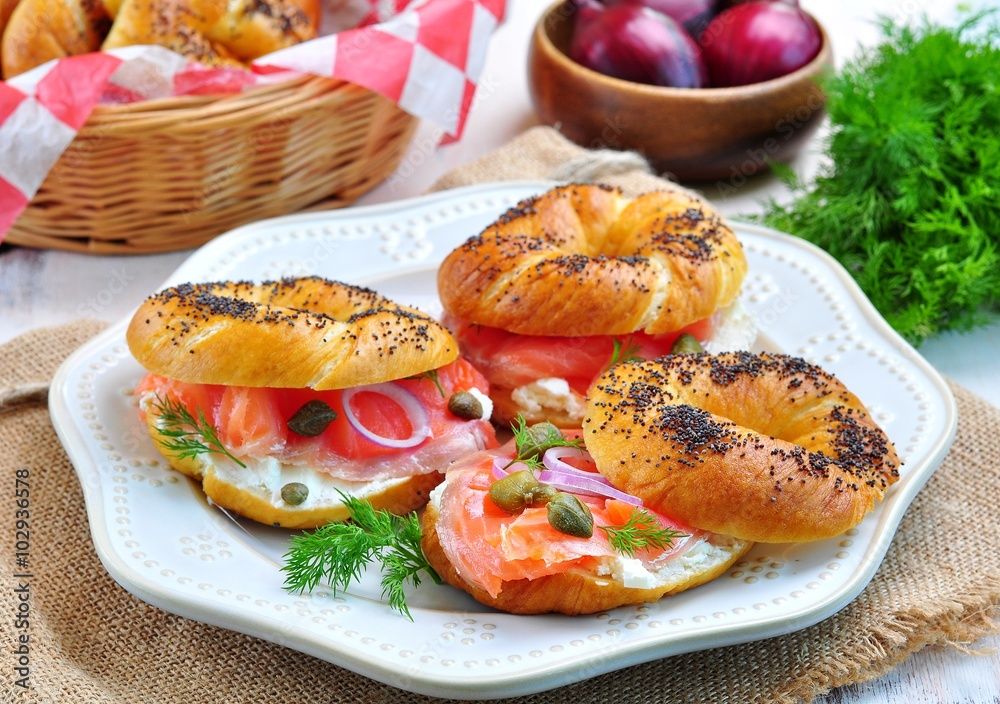 homemade bagel with smoked salmon, cream cheese, capers and onions homemade bagel with smoked salmon, cream cheese, capers and onions