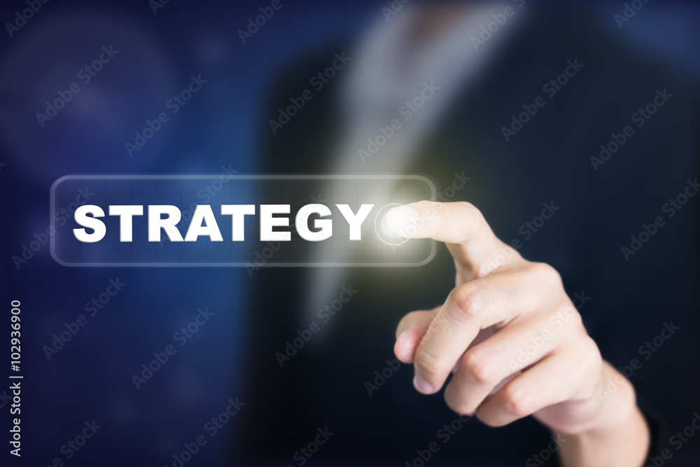 Businessman pressing a STRATEGY concept button. Can be used in advertising. Businessman pressing a STRATEGY concept button. Can be used in advertising.
