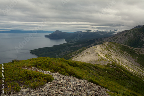 The coastal mountain range above the bay. The Sea of Okhotsk. Peninsula Kony. Magadan Region.