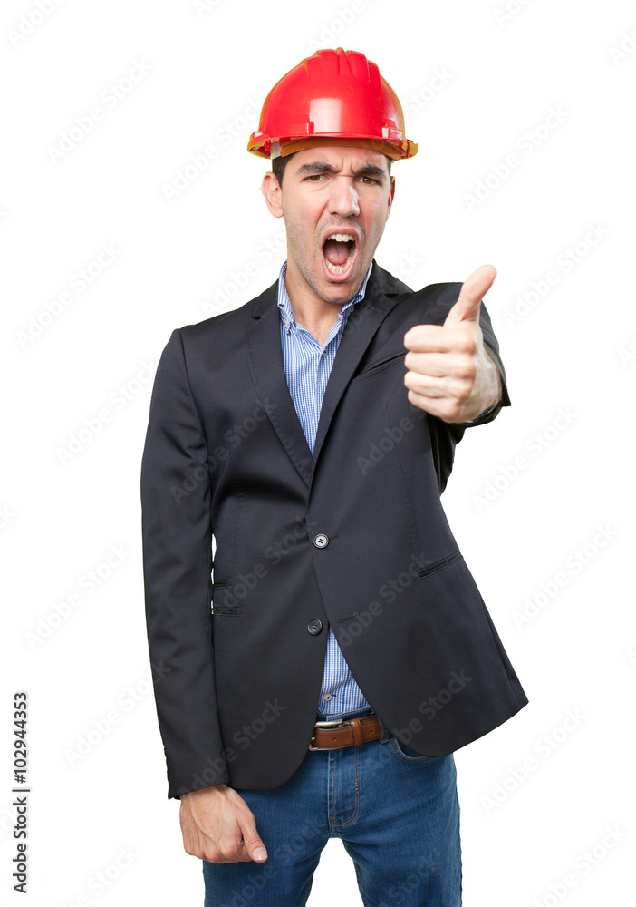 Satisfied young architect with ok gesture Satisfied young architect with ok gesture