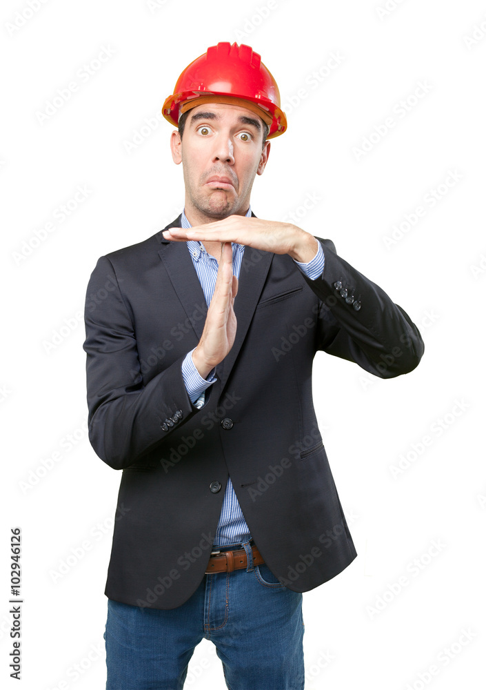 Worried architect with time out gesture Worried architect with time out gesture