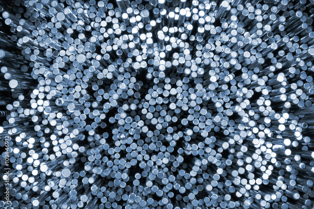 Shiny metal round bars. Blue tinted industrial background Shiny metal round bars. Blue tinted industrial background