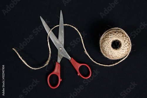  Scissors cut the  packthread