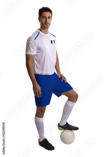 French soccer player holding ball on white background © paulovilela