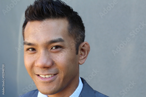 Horizontal portrait of a natural handsome classic Asian male with copy space on the right