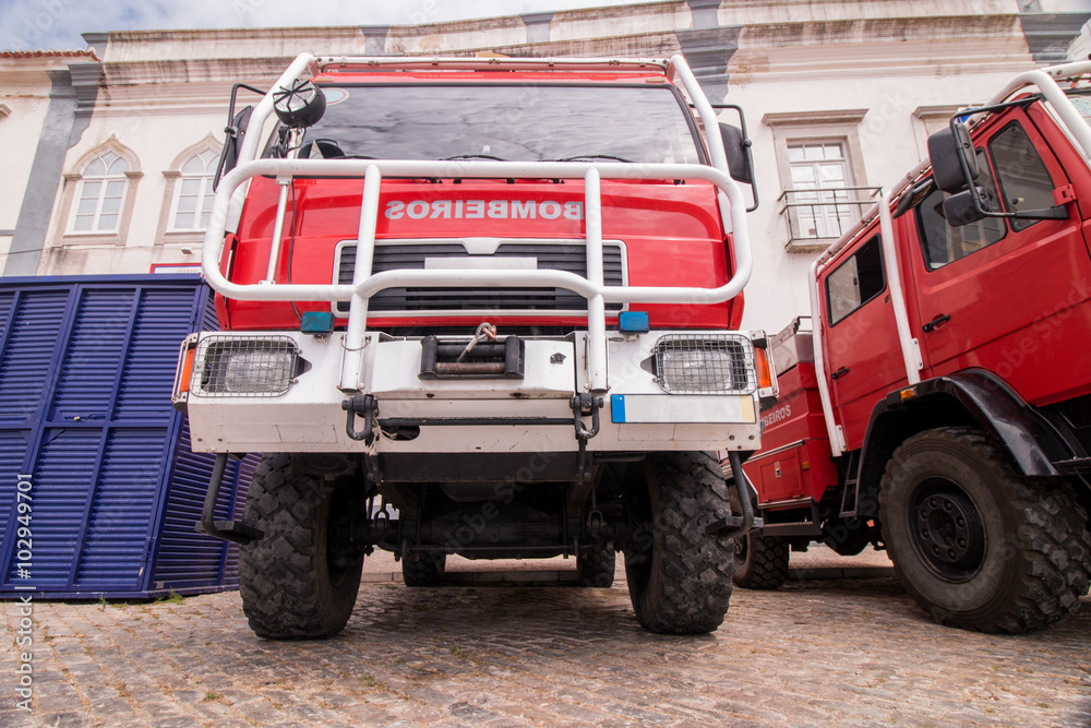 Wide perspective view of several fire trucks parked in Faro city, Portugal.