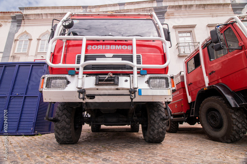 Wide perspective view of several fire trucks parked in Faro city, Portugal.