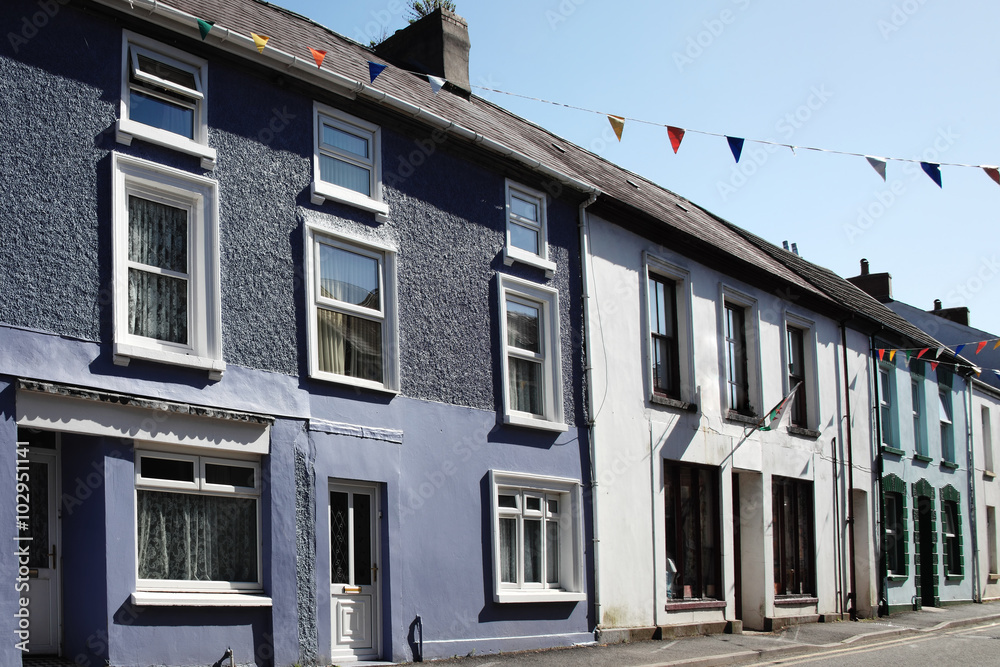 Old fashioned colourful terraced town houses in Kidwelly, Carmarthenshire, Wales, UK