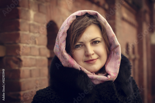 Beautiful young woman in a scarf