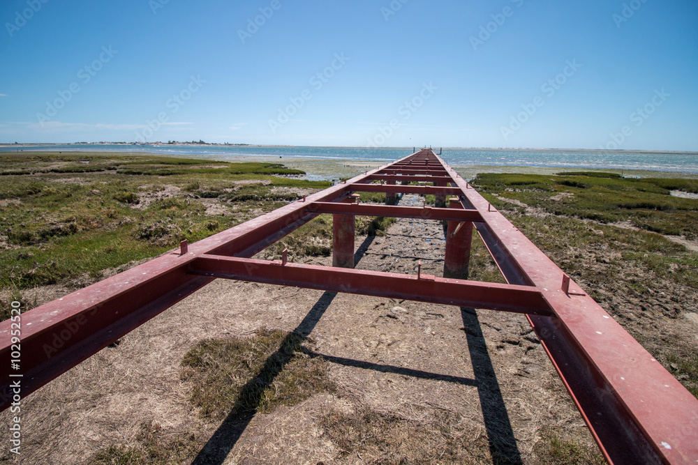 Unfinished bridge on the marshlands of Ria Formosa, Portugal. Unfinished bridge on the marshlands of Ria Formosa, Portugal.