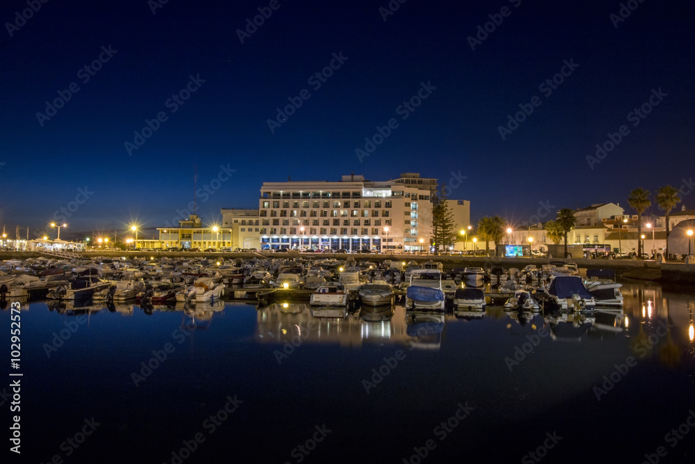 View of the peaceful marina of Faro city, Portugal at dawn.