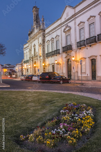 View of the main arch entrance to the historical town of Faro, Portugal at dawn.