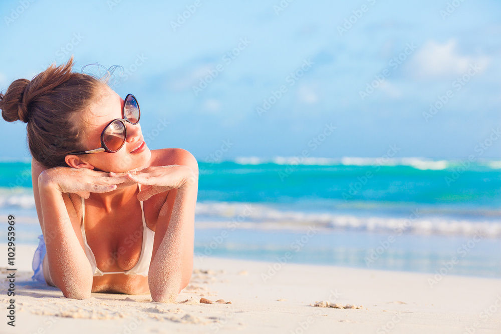 young girl in bikini and round sunglasses on tropical barbados beach young girl in bikini and round sunglasses on tropical barbados beach