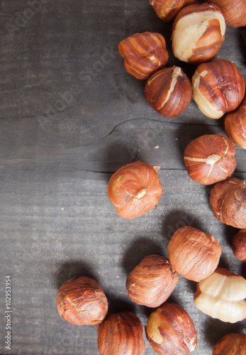 Assortment of hazelnuts on wooden deck