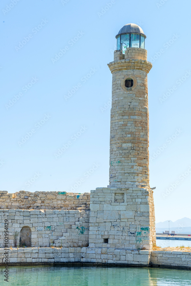 Old venetian lighthouse in city of Rethymno, Crete, Greece..