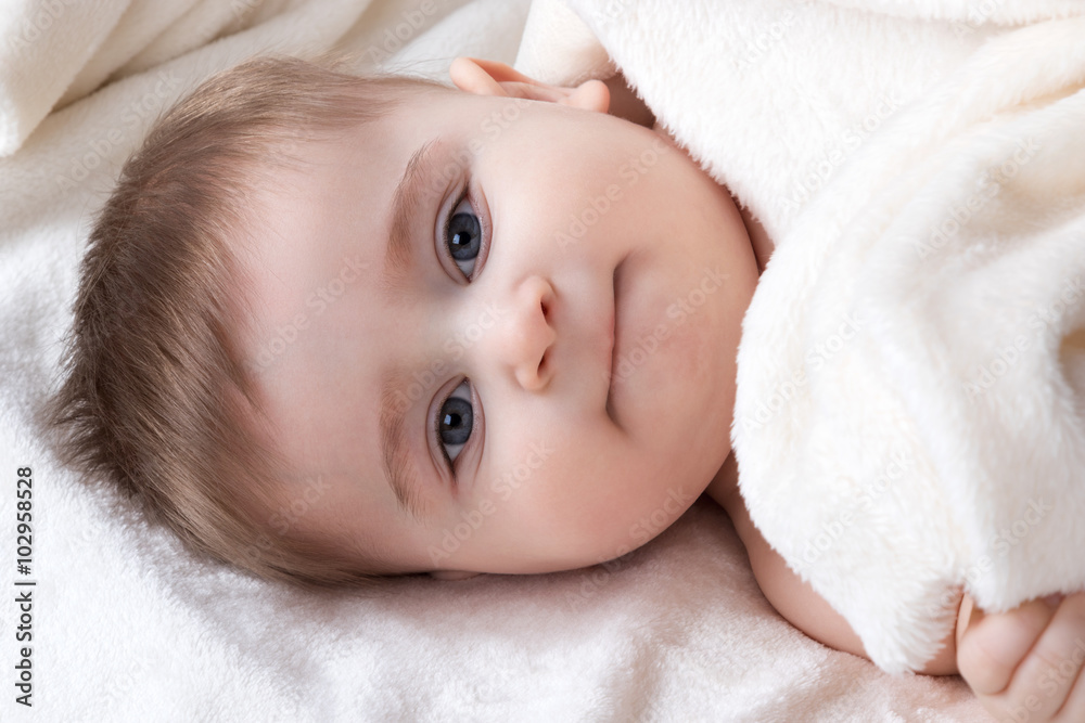 Portrait infant lying on the bed Portrait infant lying on the bed