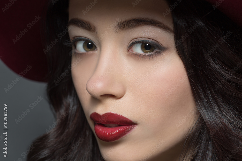 Fashion model woman with dark red hat on Fashion model woman with dark red hat on
