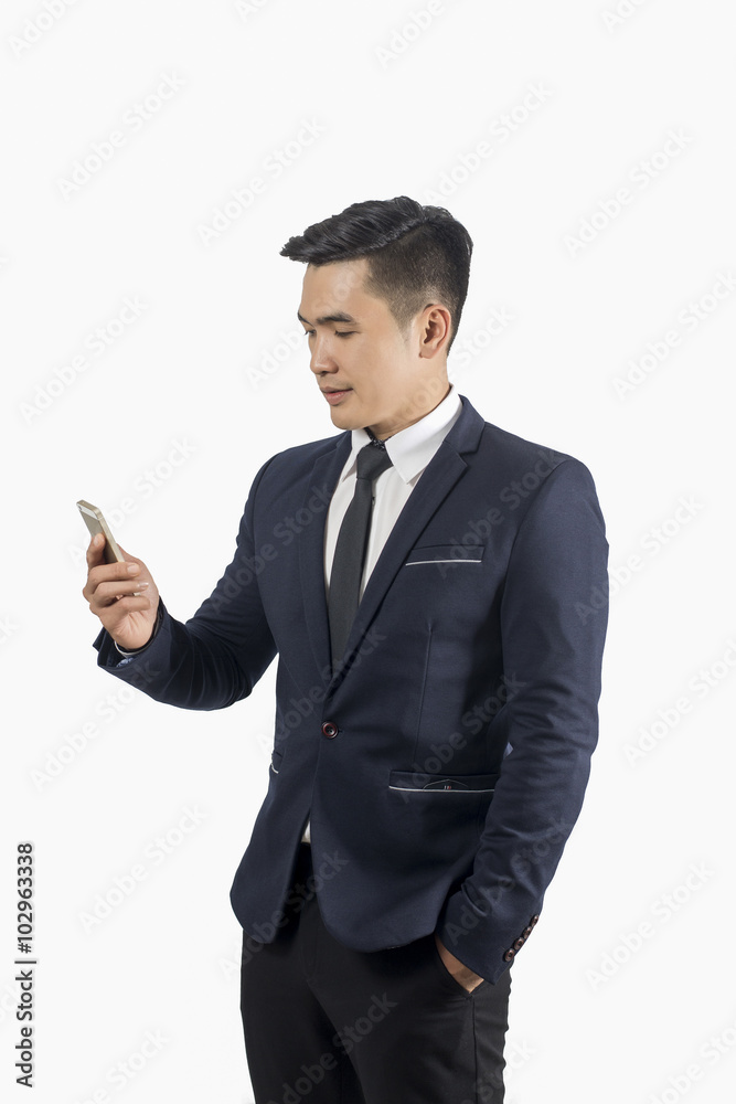 Handsome businessman using smart phone isolate on white backgrou Handsome businessman using smart phone isolate on white backgrou