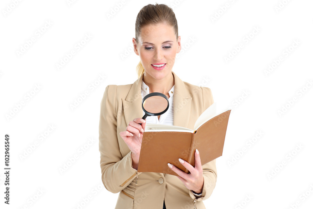 Businesswoman with agenda and magnifying glass Businesswoman with agenda and magnifying glass